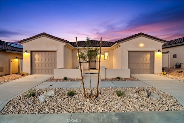 7432 Desert Sky Dr, Yucca Valley, CA 92284 - single story home with an attached garage, concrete driveway, stucco siding, and a tiled roof