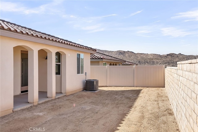 7432 Desert Sky Dr, Yucca Valley, CA 92284 - fenced backyard with a patio and a mountain view