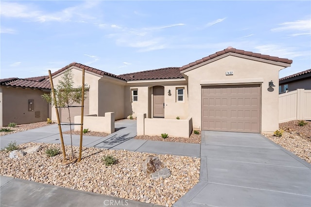 7432 Desert Sky Dr, Yucca Valley, CA 92284 - mediterranean / spanish house featuring stucco siding, an attached garage, driveway, and a tiled roof