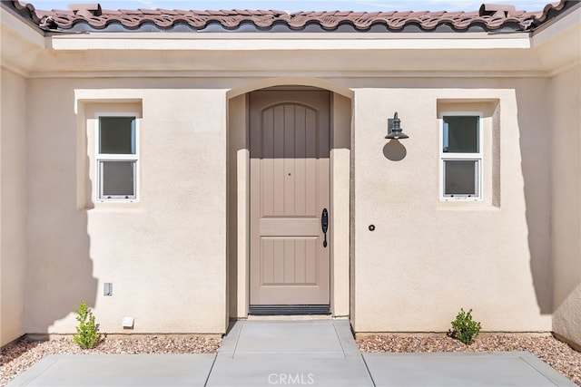 7432 Desert Sky Dr, Yucca Valley, CA 92284 - property entrance featuring stucco siding and a tile roof