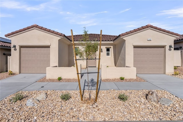 7432 Desert Sky Dr, Yucca Valley, CA 92284 - view of front facade featuring an attached garage, stucco siding, driveway, and a tiled roof