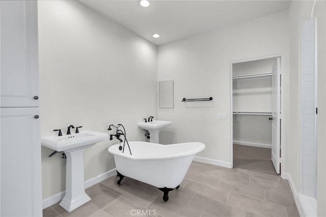 7432 Desert Sky Dr, Yucca Valley, CA 92284 - bathroom with a spacious closet, a freestanding tub, recessed lighting, and tile patterned floors