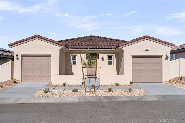 7432 Desert Sky Dr, Yucca Valley, CA 92284 - view of front facade with a garage and stucco siding