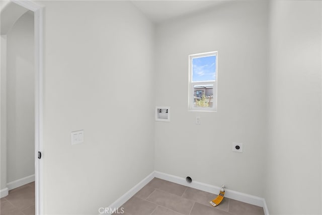 7432 Desert Sky Dr, Yucca Valley, CA 92284 - laundry area featuring arched walkways, hookup for a washing machine, hookup for an electric dryer, and light tile patterned flooring