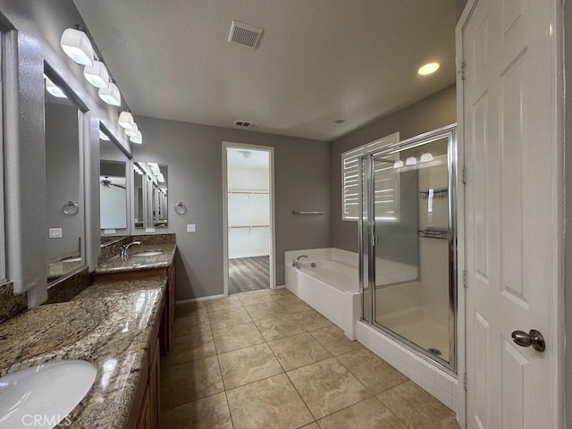 14610 Baylor Ave, Chino, CA 91710 - full bathroom with vanity, a bath, a stall shower, tile patterned flooring, and recessed lighting