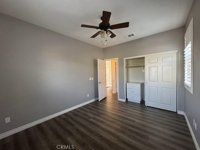 14610 Baylor Ave, Chino, CA 91710 - unfurnished bedroom featuring dark wood-style floors, a closet, and a ceiling fan