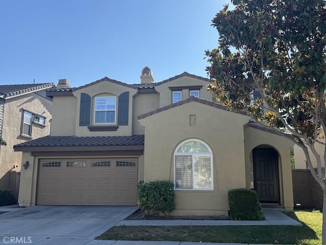 14610 Baylor Ave, Chino, CA 91710 - view of front of home featuring concrete driveway, a garage, and stucco siding