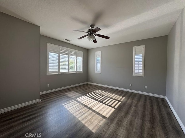 14610 Baylor Ave, Chino, CA 91710 - empty room featuring a ceiling fan, dark wood finished floors, and a textured ceiling