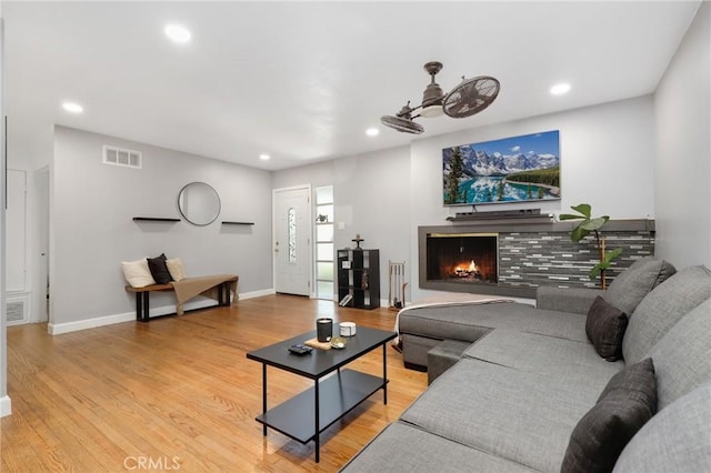 13708 El Espejo Rd, La Mirada, CA 90638 - living room featuring a lit fireplace, recessed lighting, and light wood-style floors