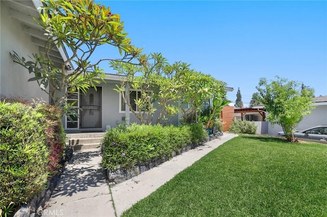 13708 El Espejo Rd, La Mirada, CA 90638 - view of front facade with a front lawn and stucco siding