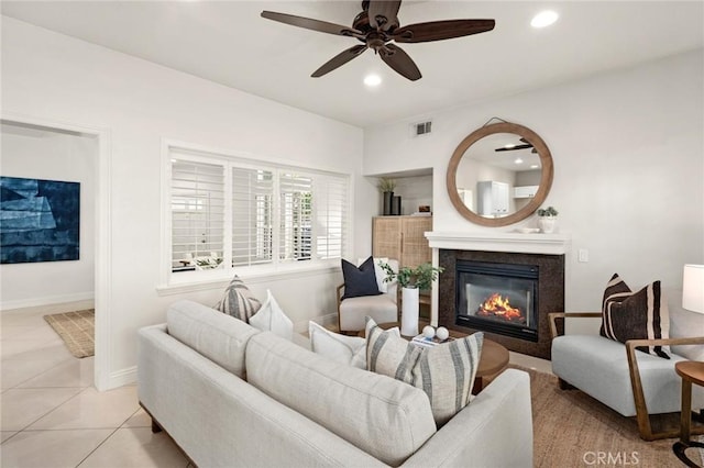 52 Anjou, Newport Coast, CA 92657 - living room with a glass covered fireplace, a ceiling fan, recessed lighting, and light tile patterned floors