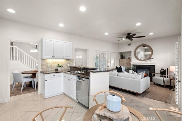 52 Anjou, Newport Coast, CA 92657 - kitchen featuring dishwasher, dark countertops, a ceiling fan, a peninsula, and recessed lighting