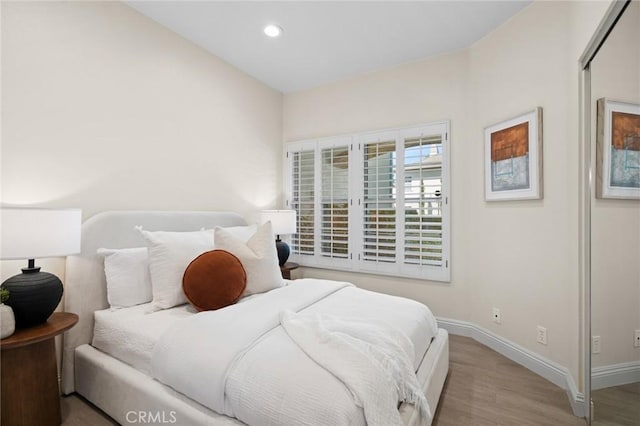 52 Anjou, Newport Coast, CA 92657 - bedroom with wood finished floors and recessed lighting