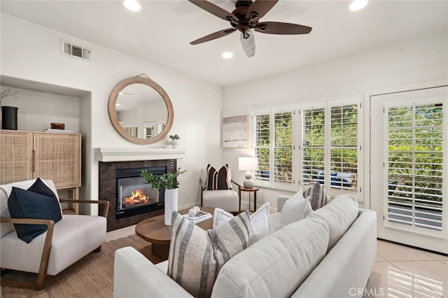 52 Anjou, Newport Coast, CA 92657 - living room featuring recessed lighting, a fireplace, plenty of natural light, a ceiling fan, and tile patterned flooring
