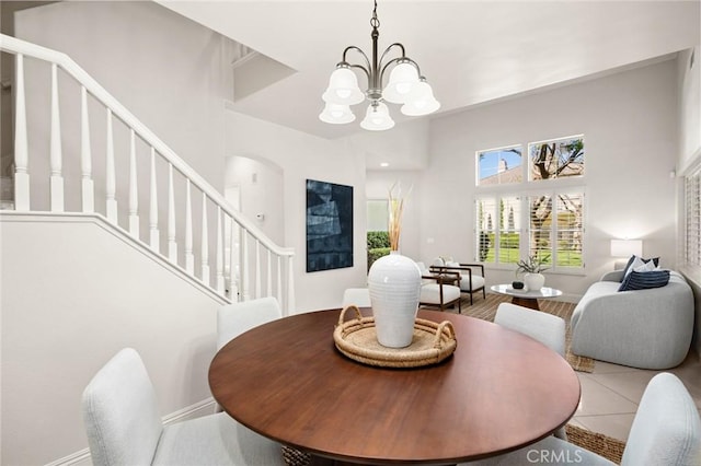 52 Anjou, Newport Coast, CA 92657 - dining room with stairway, a chandelier, and a high ceiling