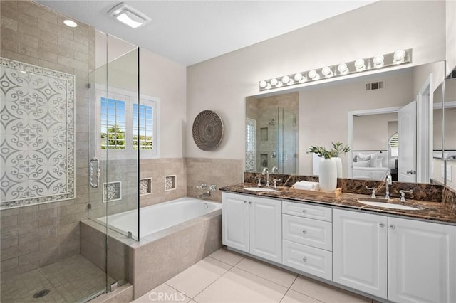 52 Anjou, Newport Coast, CA 92657 - ensuite bathroom with a garden tub, double vanity, a stall shower, and tile patterned floors