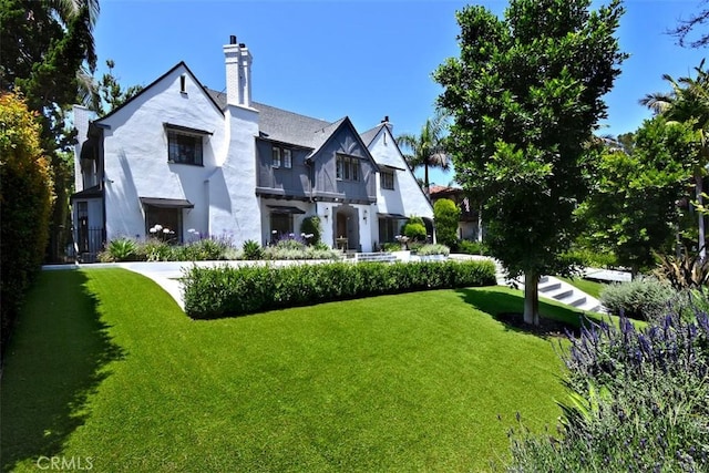 5005 Los Feliz Blvd, Los Angeles, CA 90027 - back of house featuring a yard, a chimney, and stucco siding