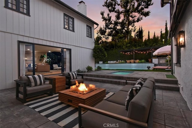 5005 Los Feliz Blvd, Los Angeles, CA 90027 - patio terrace at dusk with a patio, an in-ground hot tub, and an outdoor living space with a fire pit
