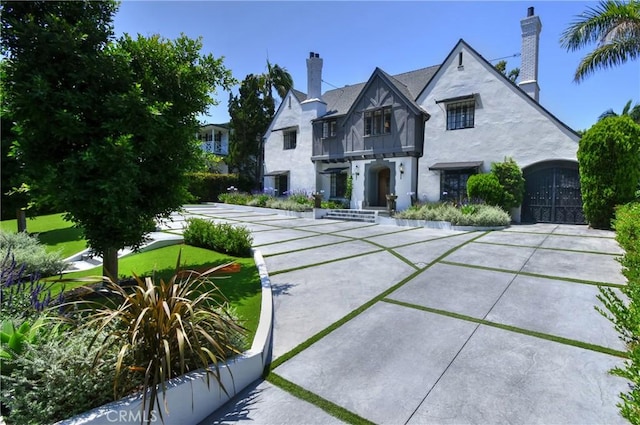 5005 Los Feliz Blvd, Los Angeles, CA 90027 - back of house featuring stucco siding, a chimney, and a balcony