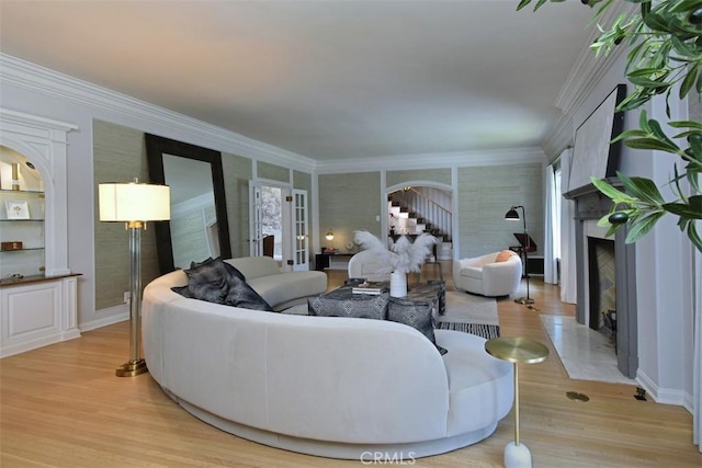 5005 Los Feliz Blvd, Los Angeles, CA 90027 - living area with a premium fireplace, light wood-style floors, crown molding, and french doors