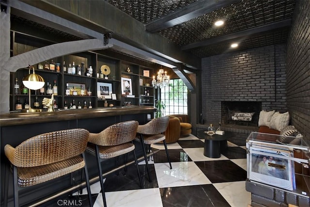 5005 Los Feliz Blvd, Los Angeles, CA 90027 - indoor dry bar featuring a brick fireplace, brick wall, a chandelier, and marble finish floors