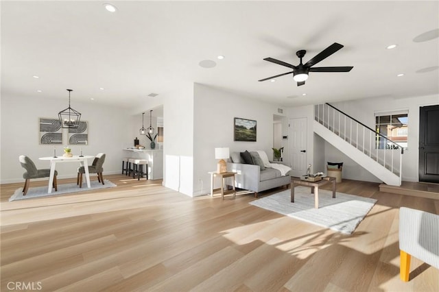 754 Manecita Cir, Perris, CA 92571 - living room featuring stairway, recessed lighting, light wood-style floors, and ceiling fan