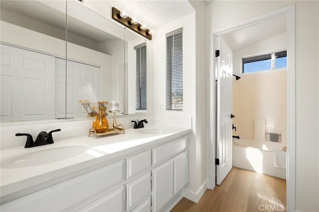 754 Manecita Cir, Perris, CA 92571 - bathroom with double vanity, wood finished floors, and bathing tub / shower combination
