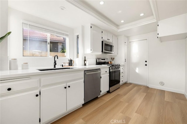 754 Manecita Cir, Perris, CA 92571 - kitchen featuring stainless steel appliances, light wood finished floors, white cabinets, recessed lighting, and light countertops