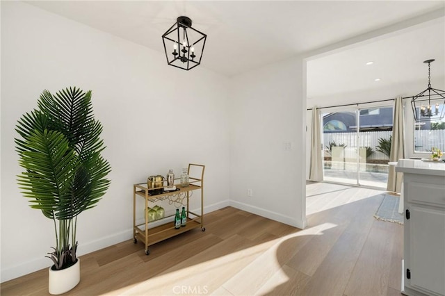 754 Manecita Cir, Perris, CA 92571 - dining space featuring a chandelier and wood finished floors