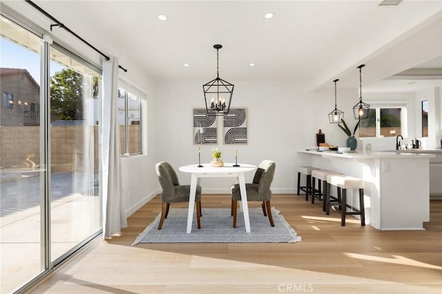 754 Manecita Cir, Perris, CA 92571 - dining space featuring light wood-style flooring, recessed lighting, and a chandelier