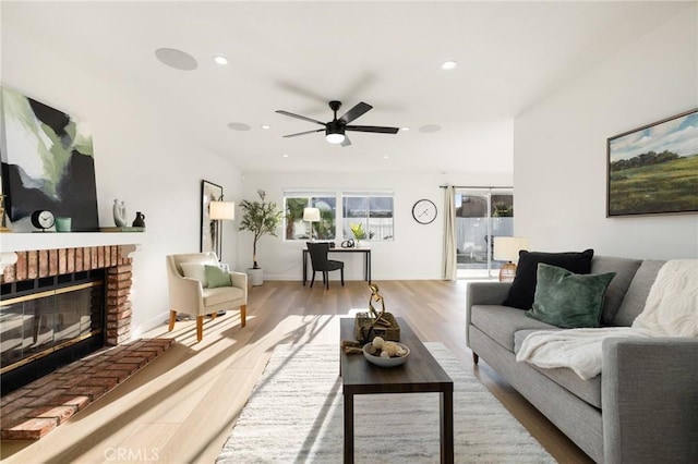 754 Manecita Cir, Perris, CA 92571 - living room featuring ceiling fan, wood finished floors, a brick fireplace, and recessed lighting