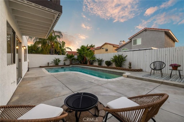 754 Manecita Cir, Perris, CA 92571 - pool at dusk with a patio and a fenced backyard