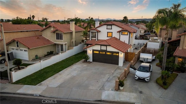 754 Manecita Cir, Perris, CA 92571 - mediterranean / spanish-style house with a residential view, a tile roof, driveway, stucco siding, and a garage
