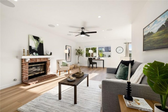 754 Manecita Cir, Perris, CA 92571 - living area with wood finished floors, ceiling fan, a brick fireplace, and recessed lighting