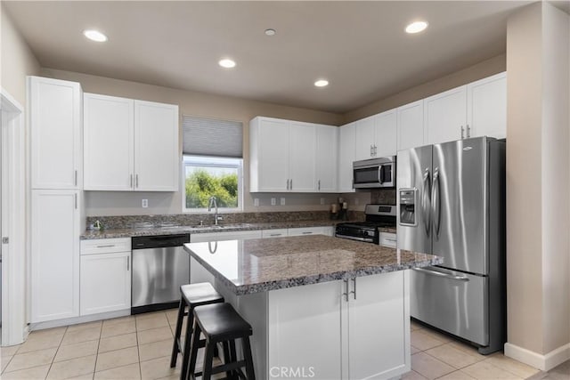 2651 W Lincoln Ave Unit 41, Anaheim, CA 92801 - kitchen with stainless steel appliances, light tile patterned floors, white cabinets, and recessed lighting
