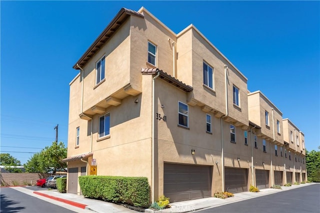 2651 W Lincoln Ave Unit 41, Anaheim, CA 92801 - view of property with an attached garage