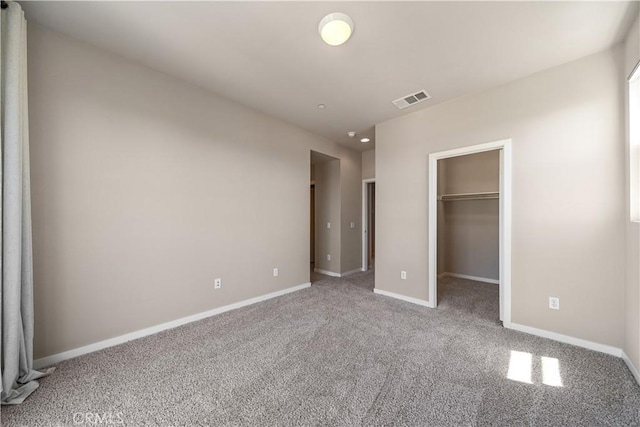 2651 W Lincoln Ave Unit 41, Anaheim, CA 92801 - unfurnished bedroom featuring carpet flooring, a spacious closet, and a closet