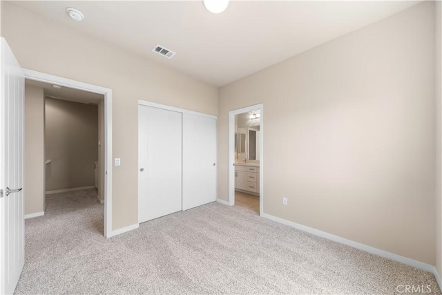 2651 W Lincoln Ave Unit 41, Anaheim, CA 92801 - unfurnished bedroom featuring carpet, a closet, and ensuite bath