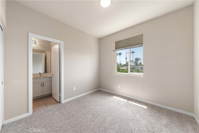 2651 W Lincoln Ave Unit 41, Anaheim, CA 92801 - unfurnished bedroom featuring light carpet and ensuite bathroom