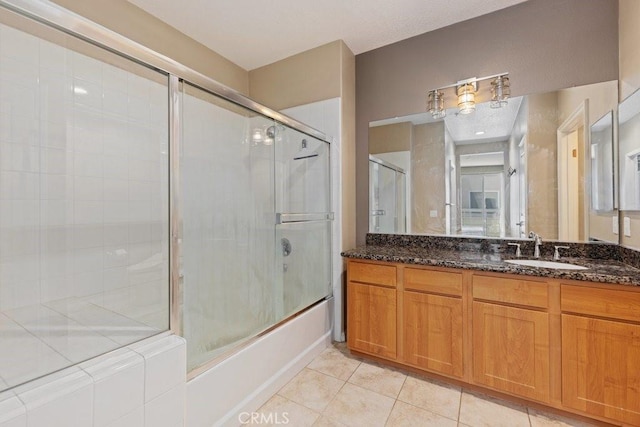 12688 Chapman Ave Unit 3403, Garden Grove, CA 92840 - bathroom featuring vanity, tile patterned flooring, and bath / shower combo with glass door