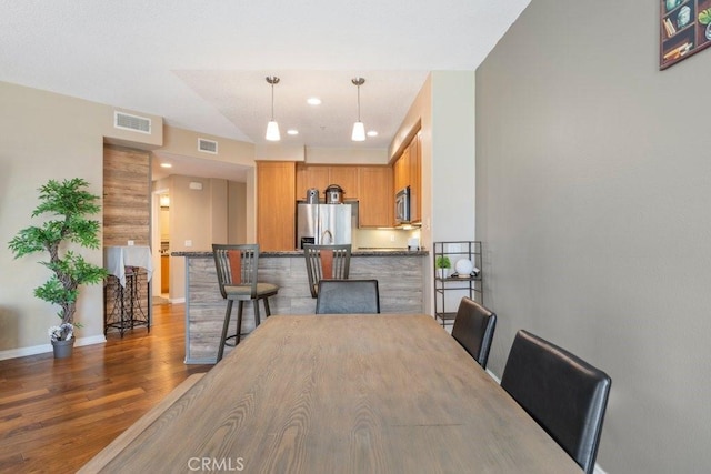 12688 Chapman Ave Unit 3403, Garden Grove, CA 92840 - dining room featuring wood finished floors and baseboards