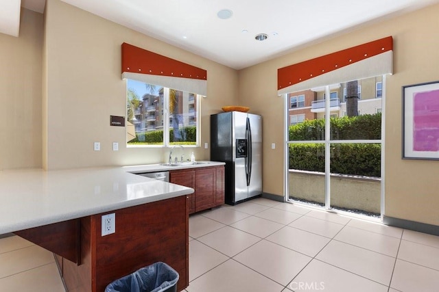 12688 Chapman Ave Unit 3403, Garden Grove, CA 92840 - kitchen with stainless steel refrigerator with ice dispenser, light countertops, a peninsula, light tile patterned flooring, and recessed lighting