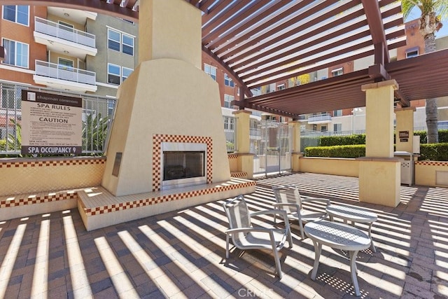 12688 Chapman Ave Unit 3403, Garden Grove, CA 92840 - view of patio / terrace featuring a fireplace and a pergola