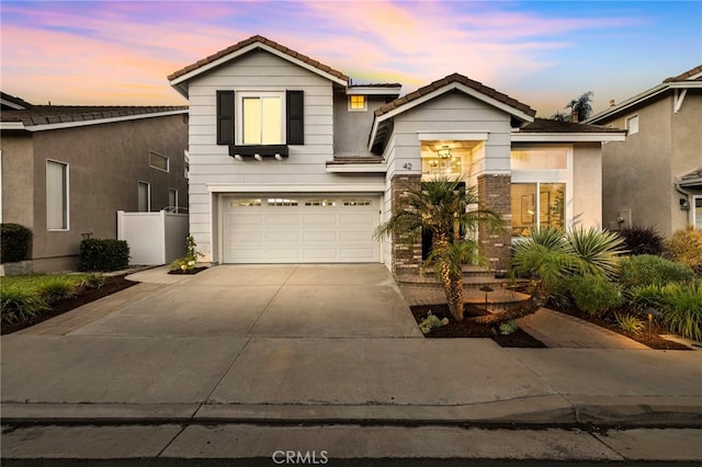 42 Beech Dr, Aliso Viejo, CA 92656 - traditional-style house featuring driveway, a garage, a tile roof, and stucco siding