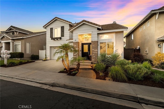 42 Beech Dr, Aliso Viejo, CA 92656 - view of front of house with an attached garage, driveway, a tiled roof, and a chimney