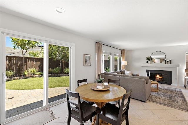 42 Beech Dr, Aliso Viejo, CA 92656 - dining area with light tile patterned floors, healthy amount of natural light, and a glass covered fireplace