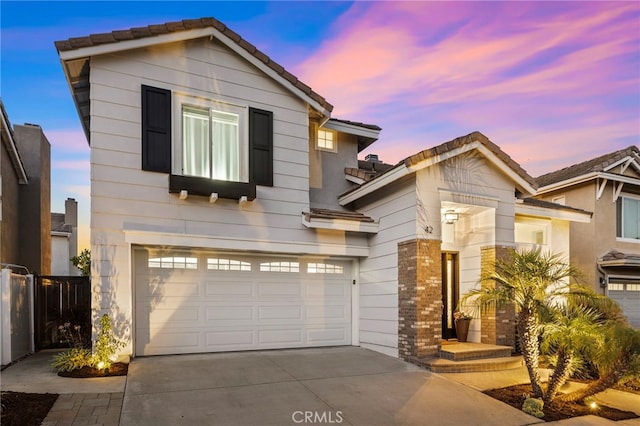 42 Beech Dr, Aliso Viejo, CA 92656 - view of front of property with concrete driveway, a tile roof, and a garage