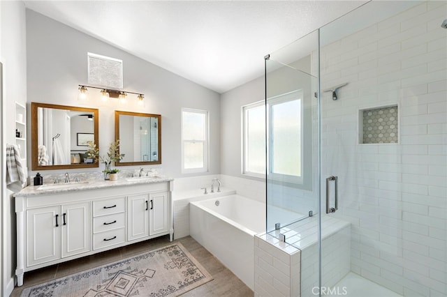 42 Beech Dr, Aliso Viejo, CA 92656 - full bathroom with lofted ceiling, double vanity, a bath, and a stall shower