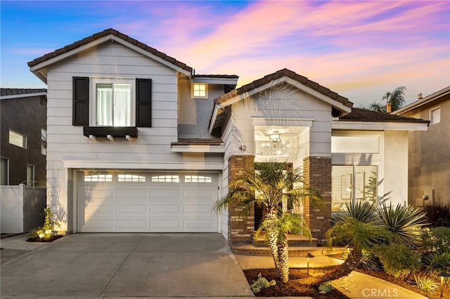 42 Beech Dr, Aliso Viejo, CA 92656 - view of front of house with concrete driveway, a tiled roof, and a garage