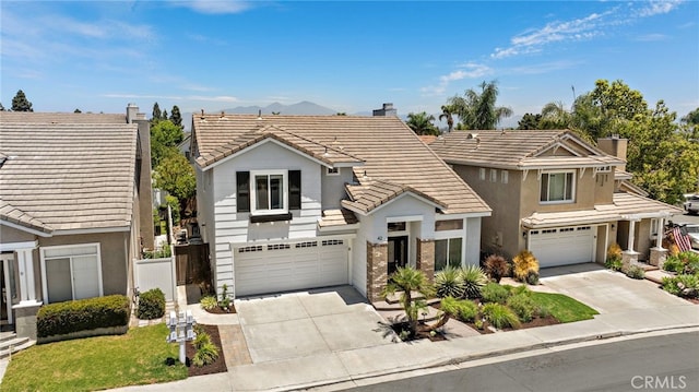 42 Beech Dr, Aliso Viejo, CA 92656 - traditional home with a chimney, driveway, a garage, and a tiled roof